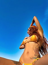 Big boobs tattoed MILF xAmbretta tans in micro bikini
